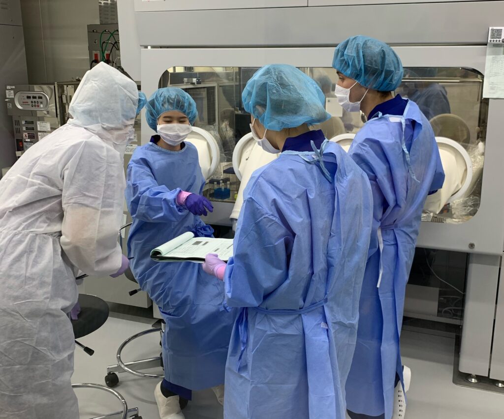 Manufacturing team members producing GMP iPSCs in the GMP celll facility in Japan